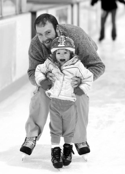 Father and Daughter at Ice Skating Rink